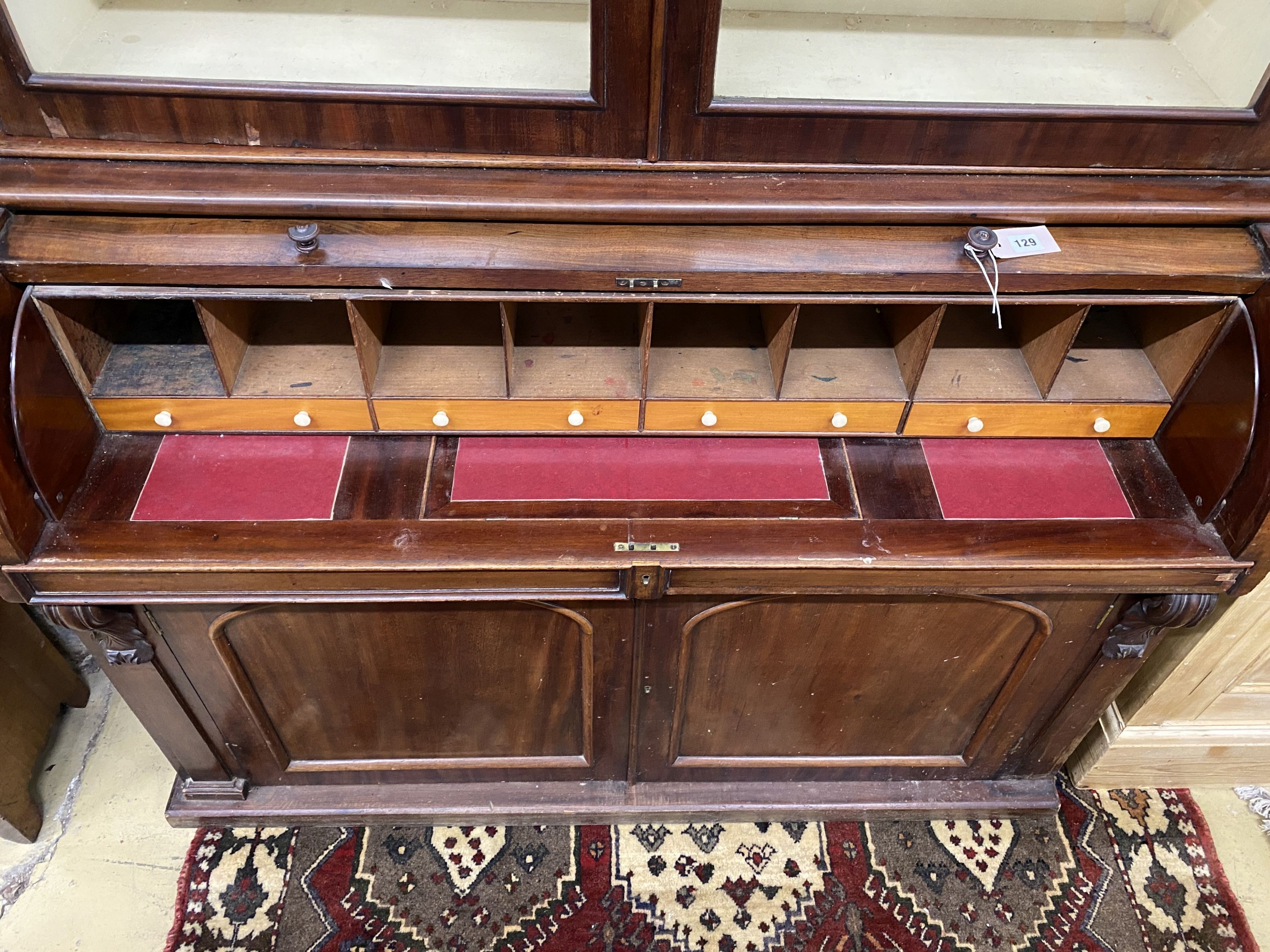 A Victorian mahogany cylinder bureau bookcase, width 130cm, depth 59cm, height 216cm